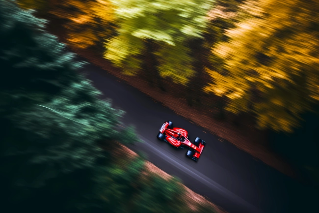 F1 car racing in the forest - drone view