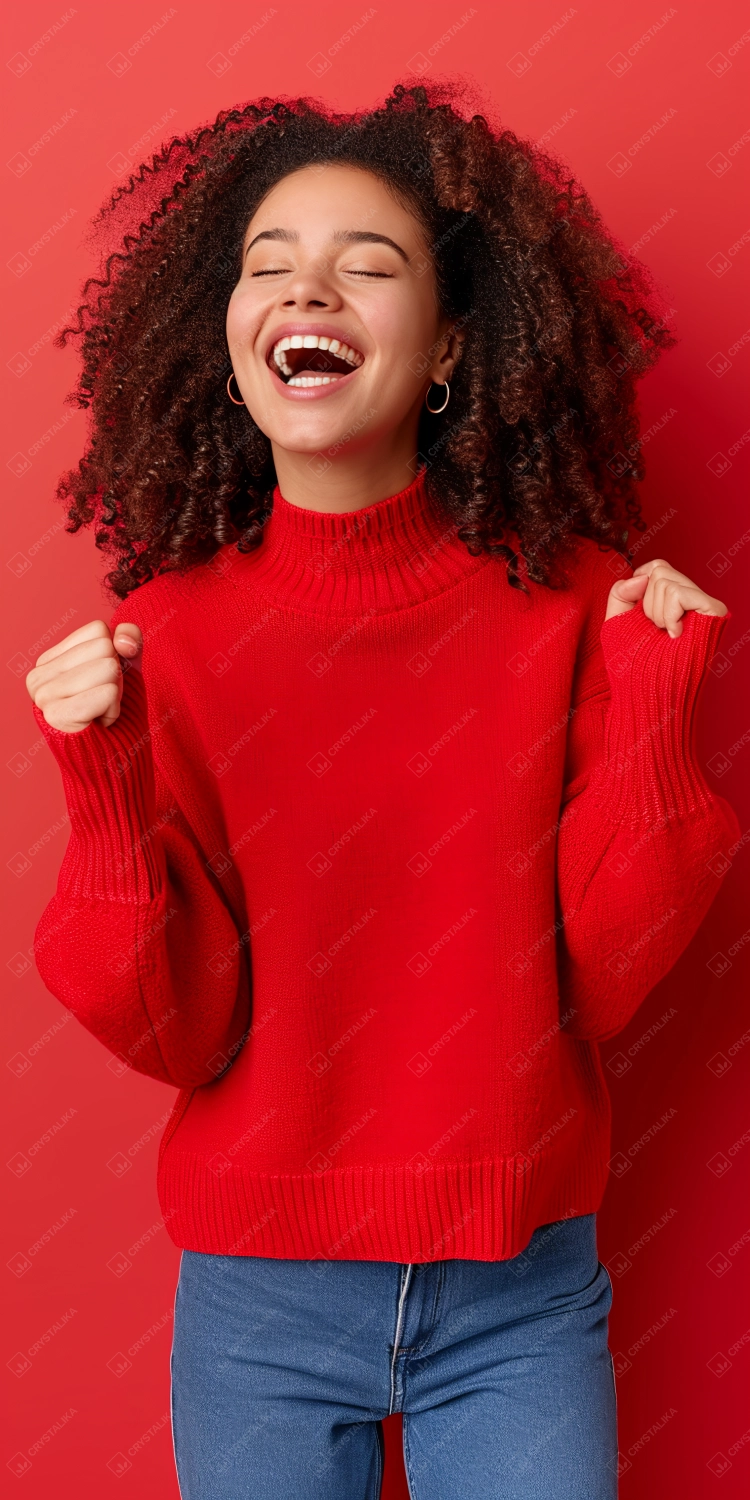Young african american woman laughing, red background
