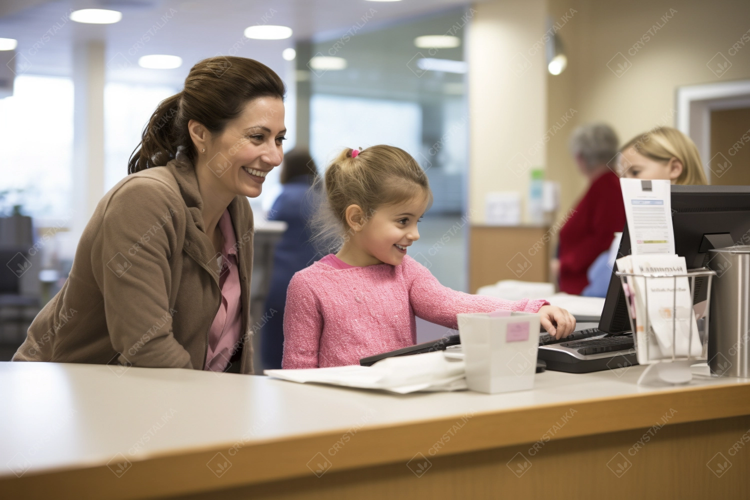 Mother with her daughter at reception desk in the hospital